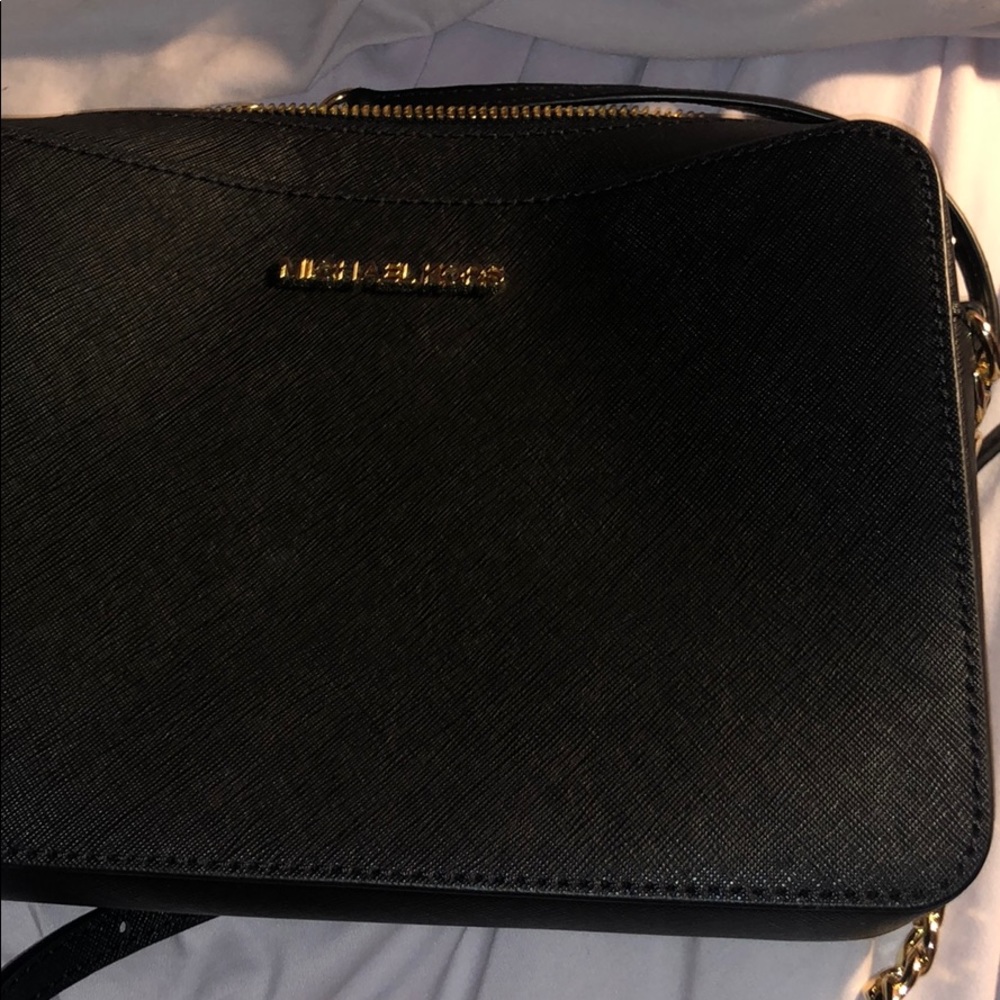 Black cross body Michael Kors purse